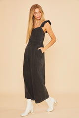 Black Denim Jumpsuit With Ruffle Shoulder Strap